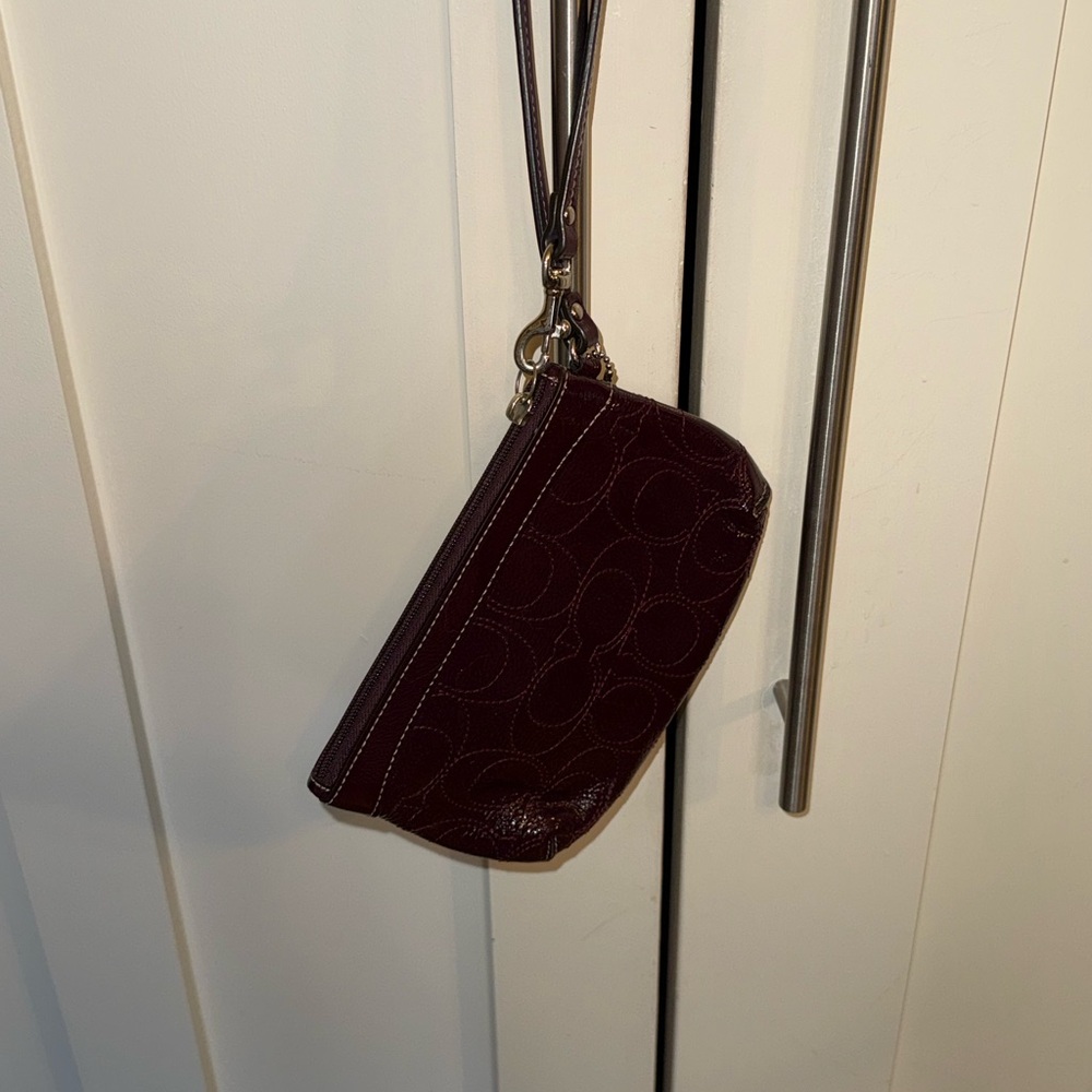 Coach plum wristlet